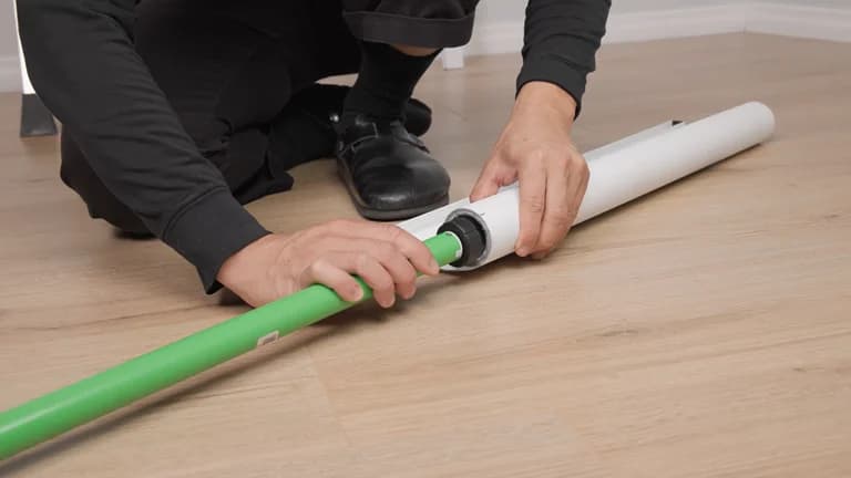 The new motor being slid into the end of the fabric roll tube