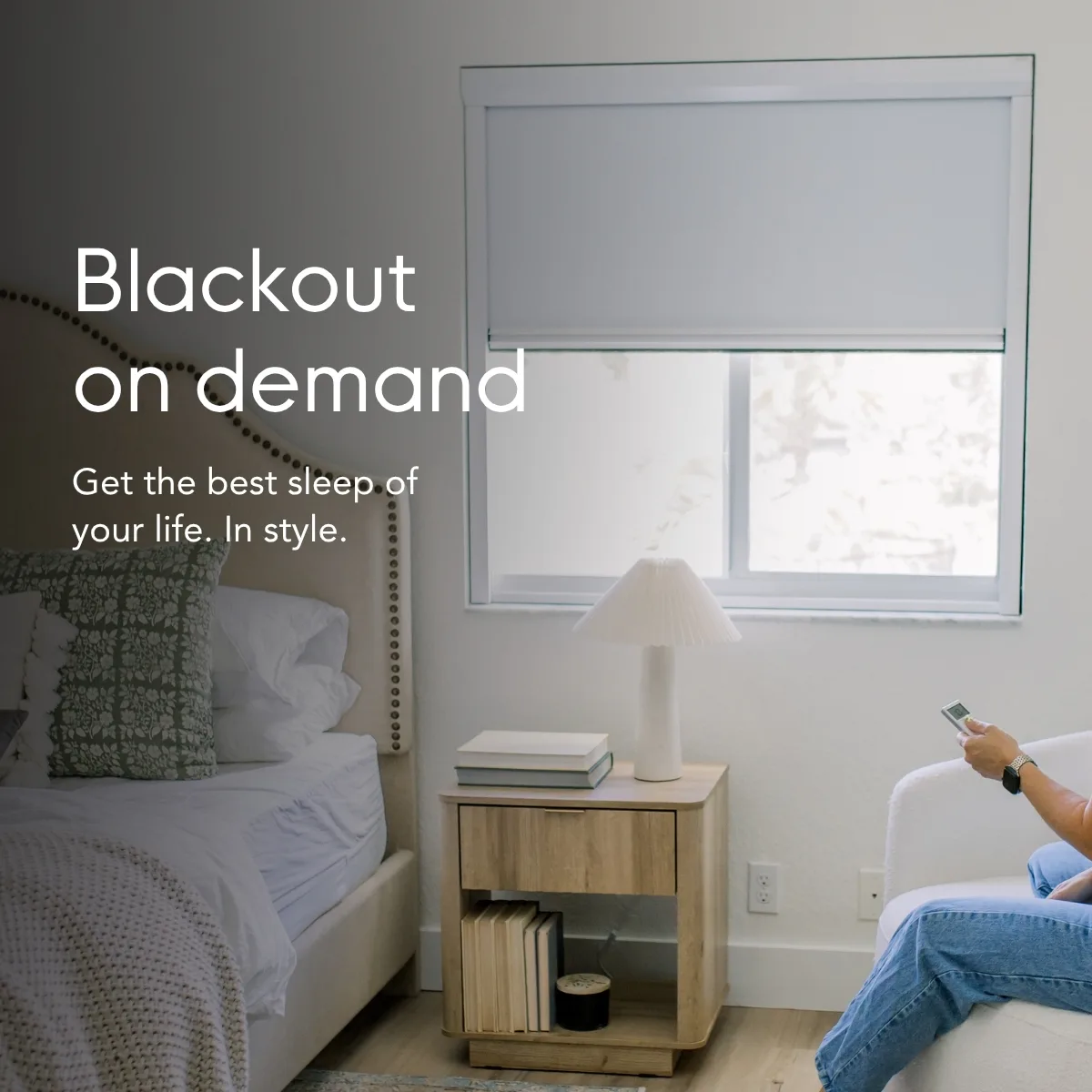 Blackout on demand — get the best sleep of your life, in style. Shown in a bedroom with the shade lowered by remote