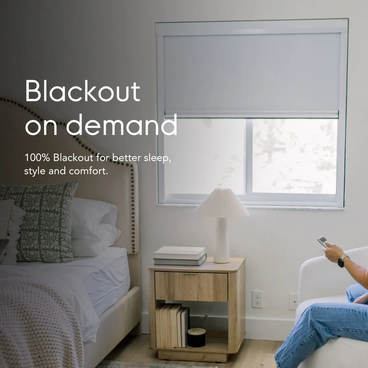 Blackout on demand — 100% blackout for better sleep, style and comfort, shown in a bedroom with the shade lowered by remote